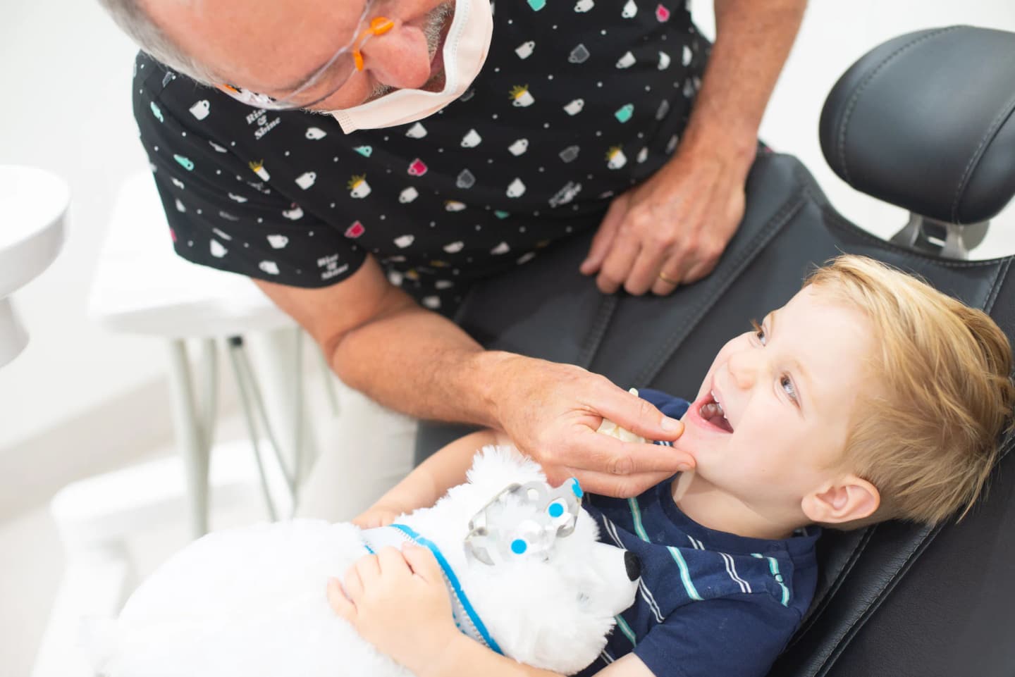 Child smiling during a relaxed dental appointment