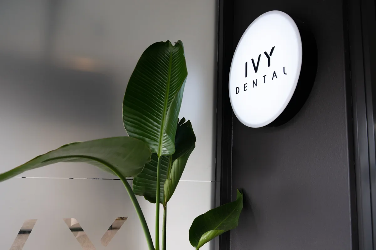 Ivy Dental illuminated sign and indoor greenery